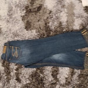 Seven ripped jeans with leopard  on the inside